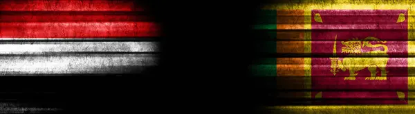 イエメンとスリランカの黒い背景の旗 — ストック写真