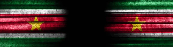Suriname and Suriname Flags on Black Background