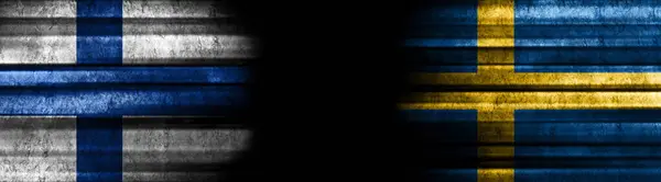 Finland and Sweden Flags on Black Background