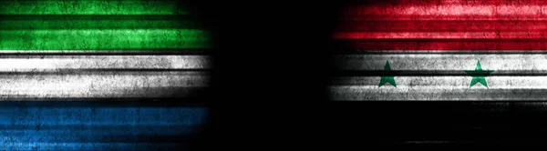 塞拉利昂和叙利亚黑色背景旗 — 图库照片