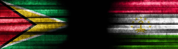 Bandeiras Guiana Tajiquistão Sobre Fundo Preto — Fotografia de Stock