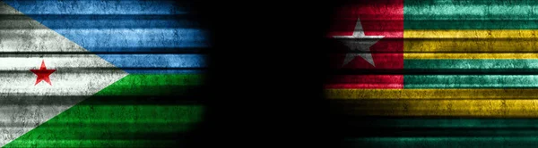 吉布提和多哥黑色背景旗帜 — 图库照片