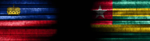 Liechtenstein Och Togo Flaggor Svart Bakgrund — Stockfoto