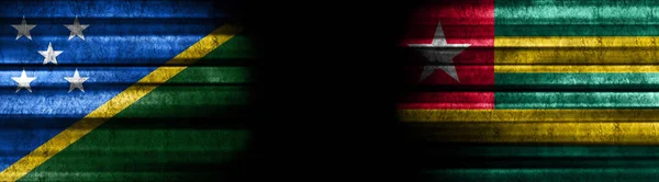Solomon Islands and Togo Flags on Black Background