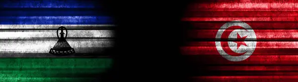 Lesotho and Tunisia Flags on Black Background