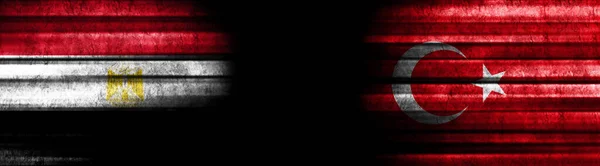 Egypt and Turkey Flags on Black Background