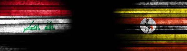 黒い背景にイラクとウガンダの旗 — ストック写真