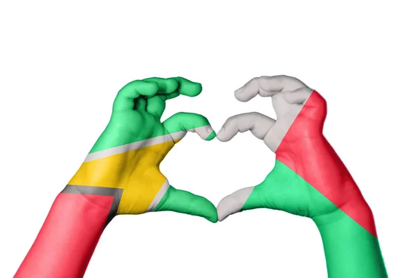 圭亚那马达加斯加心 手手势造心 收割之路 — 图库照片