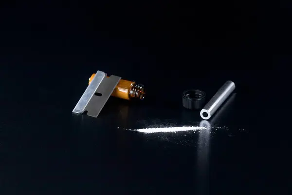 stock image Cocaine Line and Razor Blade on a Black Background