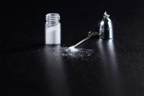 stock image Cocaine on a Black Background, Cocaine Bottle  