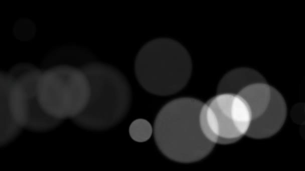 摘要黑色背景上的白色光泽和颗粒 黑底上有漂亮的白色Bokeh的循环动画 — 图库视频影像