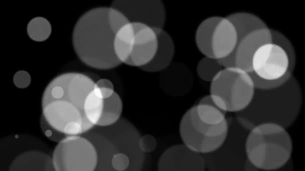 摘要黑色背景上的白色光泽和颗粒 黑底上有漂亮的白色Bokeh的循环动画 — 图库视频影像