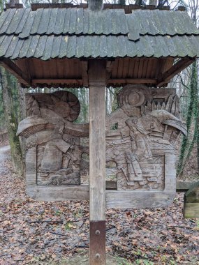 the open-air museum of traditional wooden architecture in the national park in Ukraine, wooden sculpture view