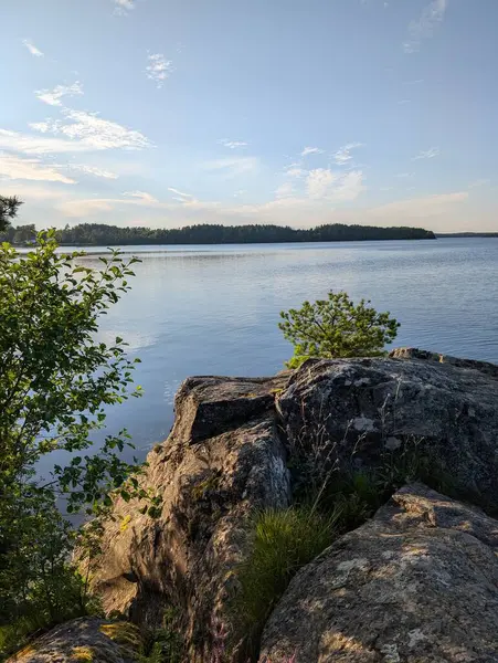 stock image Lake at Rde in Norway surrounded green trees  