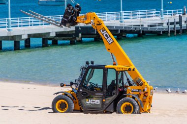 Rockingham, WA / Australia - 11/15/2019 Manitou bogged on the beach during the revamp of the Rockingham foreshore. clipart