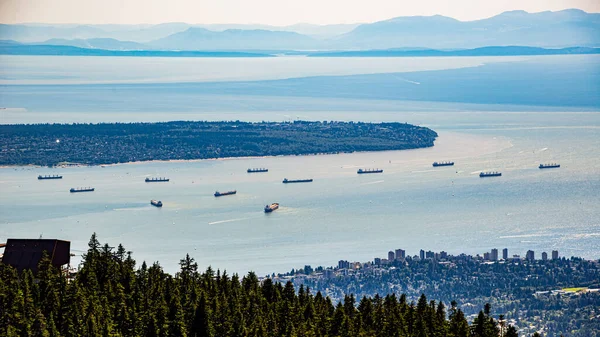 Vancouver, British Columbia / Canada - 06/13/2015. Ships on the water in Vancouver Harbour