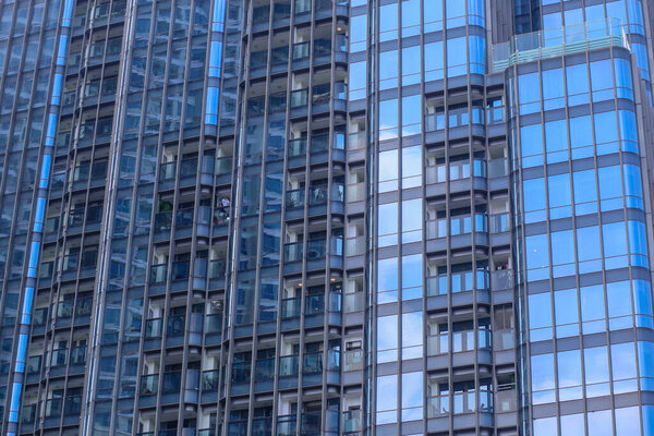Glass window background of a high-rise building