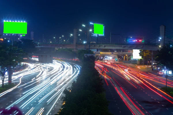 Time lapse photo at Dien Bien Phu street, Ho Chi Minh city with billboards with green background in Vietnam