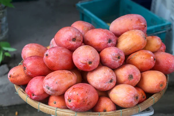 Fruits such as red mango are sold at Dam market, Nha Trang City , Khanh Hoa