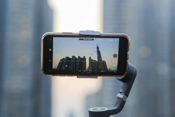 stock image Ho Chi Minh City, Vietnam - Mar 05 2023: Photo of Landmark 81 and high-rise apartment buildings at sunset, view from phone mounted on gimbal