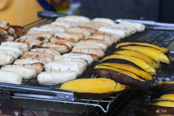 Closeup of Grilled bananas are sold and prepared on the streets in spring