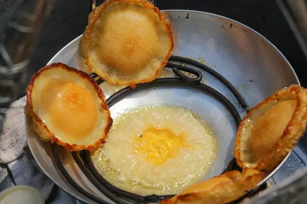Closeup of Bird\'s nest cake cooking on the pan in An Giang Province, Vietnam