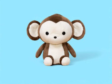 Mavi arka planda oturan şirin küçük maymun.