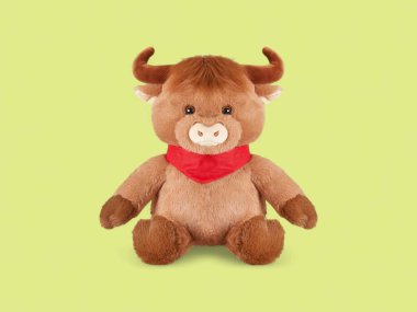 Baby highland cattle soft toy stuffed toy on the yellow background