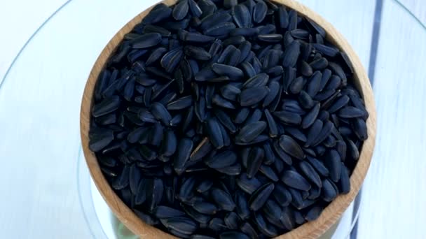 Roasted Sunflower Seeds Close Rotate Wooden Bowl Harvesting Sunflower Unpeeled — Stock Video