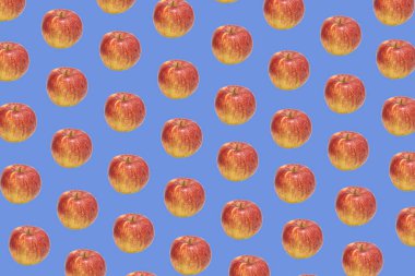 Mavi arka planda olgun Jonagold elmalarından oluşan desen