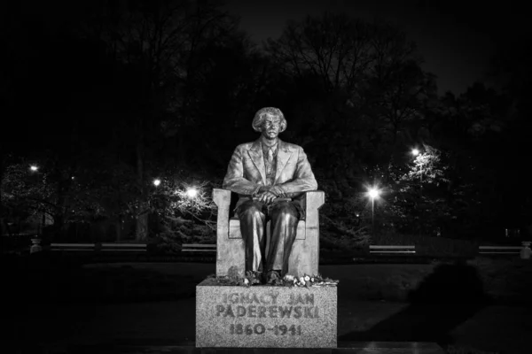 Pianist composer and politician Ignacy Jan Paderewski monument in city park in warsaw at night, black and white image