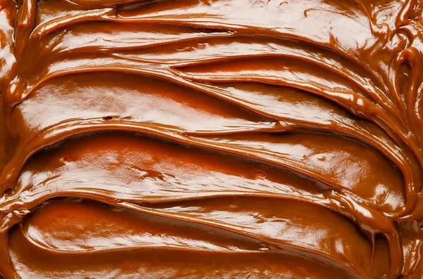 Dulce de leche dokusunun en üst görüntüsü. Yatay biçim. 