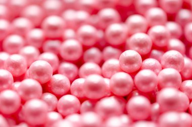 Pembe yenilebilir incilerin yatay formatında arkaplanı.