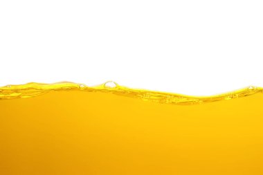orange juice is isolated on white background. healthy fresh drink and natural waves. close up view.