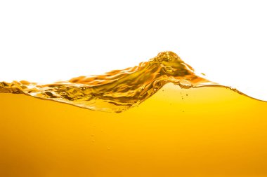orange juice is isolated on white background. healthy fresh drink and natural waves. close up view.