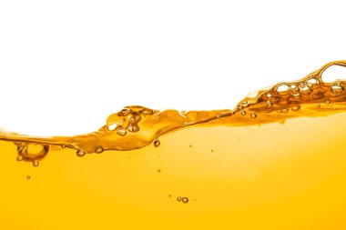 orange juice is isolated on white background. healthy fresh drink and natural waves. close up view.