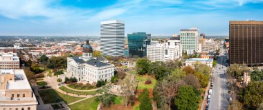 Drone panorama of the South Carolina Statehouse and Columbia skyline on a sunny morning. Columbia is the capital of the U.S. state of South Carolina and serves as the county seat of Richland County clipart