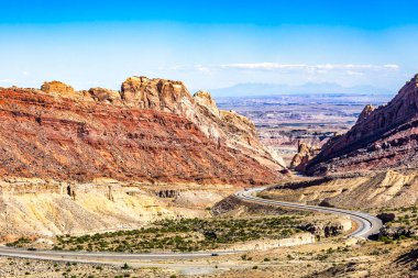 Interstate I-70 running through Spotted Wolf Canyon in Utah. Little Spotted Wolf Canyon is located in the San Rafael Swell near Green River, Utah clipart