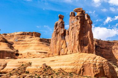 Three Gossips in Arches National Park, Utah. Like many of the rock formations in the park, Three Gossips is composed of Entrada Sandstone. clipart