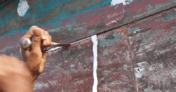 Worker Repairing Hull Fishing Boat Plugging Holes String — Stock Video