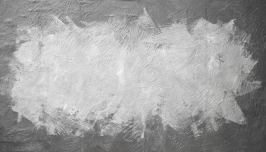 Smudged gray and white paint rectangle on concrete texture, close up photography