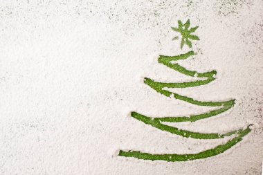Christmas tree finger draw, on powder sugar, minimal holiday background