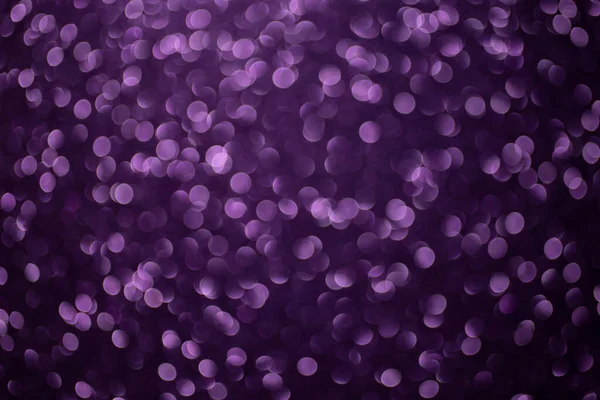 Violet glitter defocused, bokeh balls background, close up