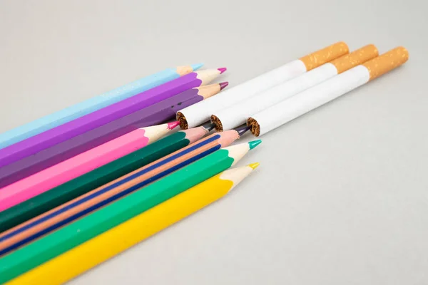 Cigarettes Colored Crayons Gray Paper Backdrop Soft Focus Close — Stock Photo, Image
