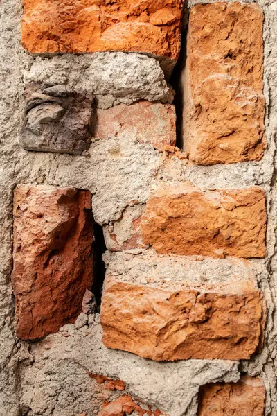 Demolition of a brick wall , construction backdrop , abstract textures