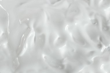 Beyaz krem dalgaları ve dalgalar, yumuşak odaklanma yakın çekim, soyut desen