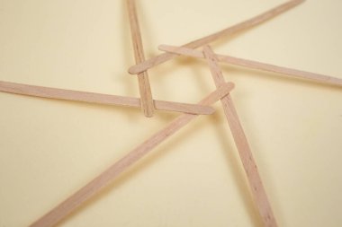 Bamboo wooden sticks demonstrating a reciprocal frame structure  clipart