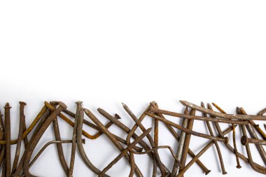 Border made of rusty bent nails on white   clipart