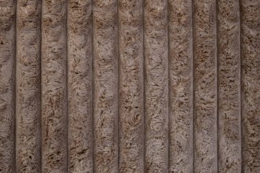 Kalın lifli kadife döşeme, kahverengi renkli dikey arka plan, soyut doku.  