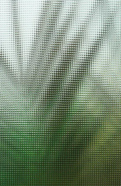 Açık yeşil arka planda egzotik palmiye yaprakları, kıvrımlı cam dokusu boyunca bitki siluetleri, soyut arkaplan  